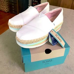 NEW! TOMS white high platform slip-on sneaker. Sole is colored in pastels line.